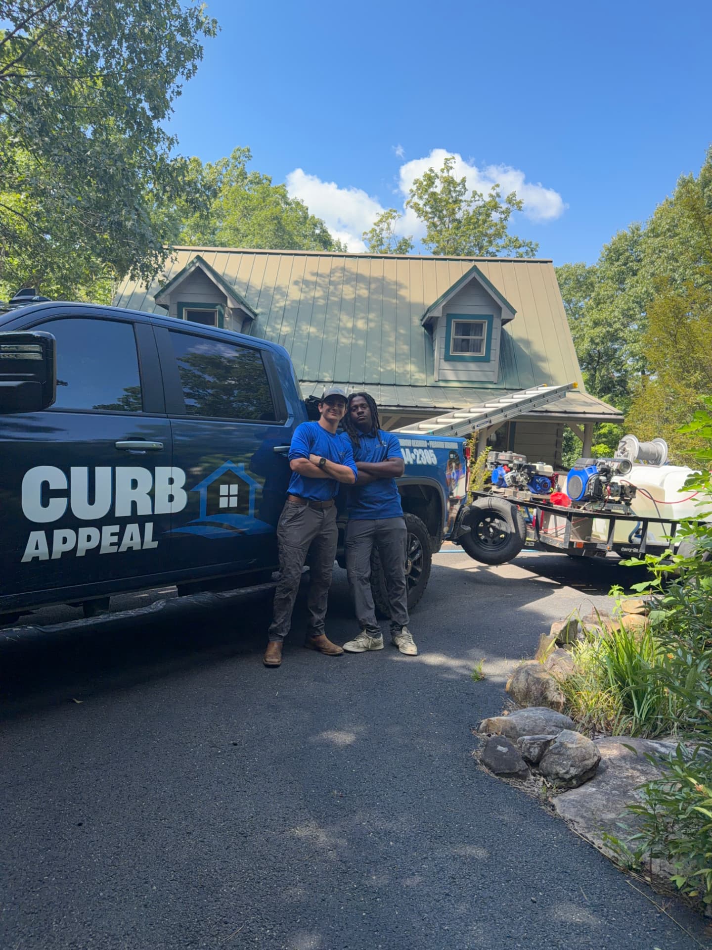 The Curb Appeal team on site in front of a Chattanooga home